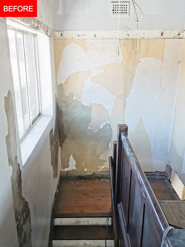 house-renovation-home-repair-stairs-wall-damaged