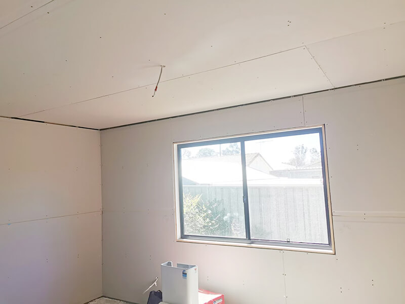 plasterboard granny flat bedroom wall and ceiling with window feature