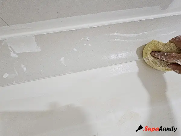 Clean Excess with A Damp Sponge for a smooth finish
