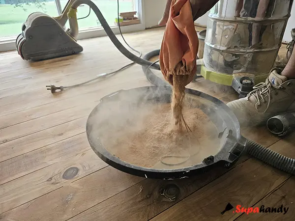 Remove sanding dust from the vacuum filter connected to the sander