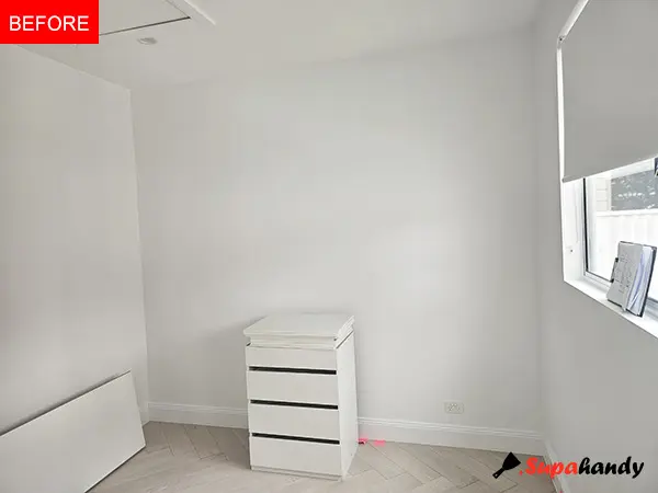 the bedroom before the installation of custom-fitted dressers