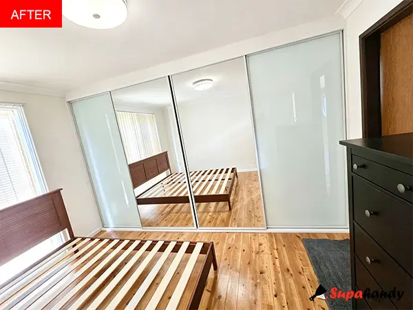 a four-door sliding built-in wardrobe, custom-fitted to maximise every inch of space