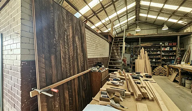 Joining raw timber planks into a massive feature panel