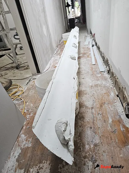 Apply adhesive along cornice edges